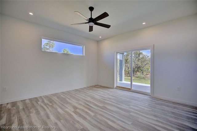 unfurnished room featuring light hardwood / wood-style floors and ceiling fan