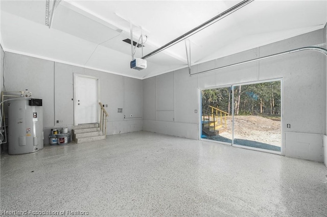 garage featuring a garage door opener and water heater