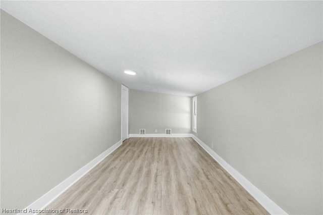 spare room with light wood-type flooring