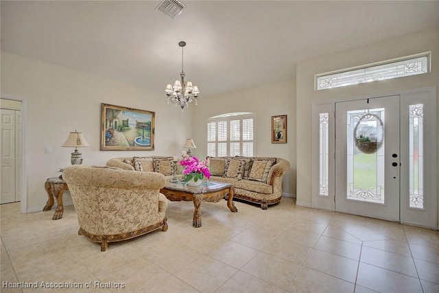 tiled living room featuring a chandelier