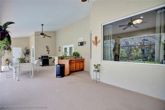 view of patio with glass enclosure and ceiling fan