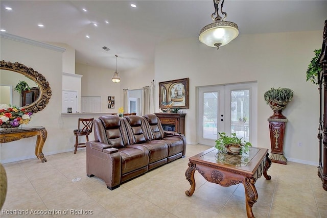 living room with high vaulted ceiling and french doors