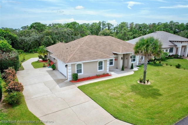 view of front facade featuring a front yard and a garage