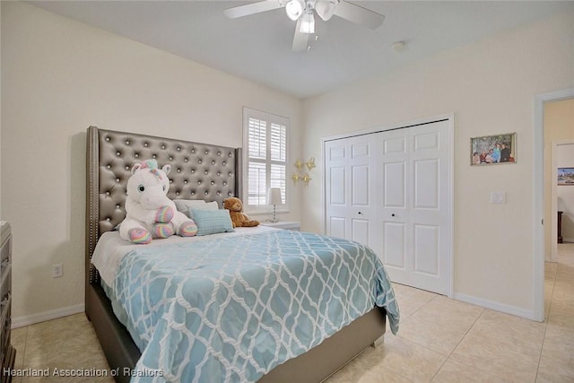 bedroom featuring a closet, ceiling fan, and light tile patterned flooring