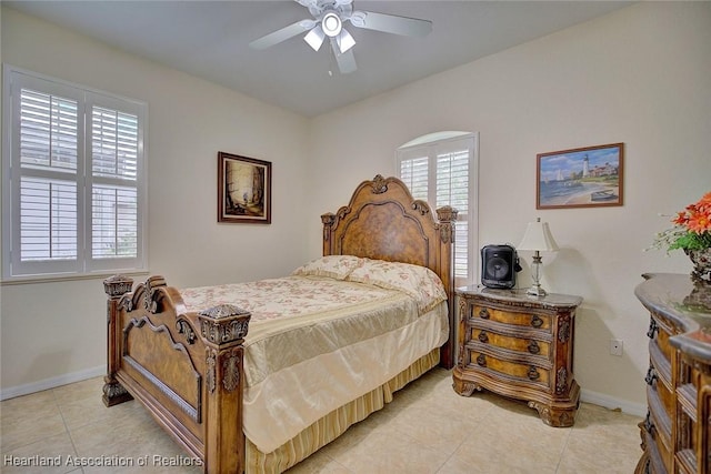 tiled bedroom with ceiling fan