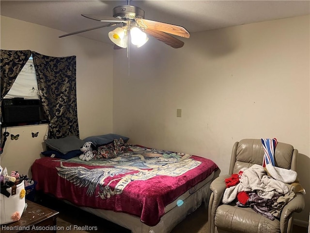 bedroom with ceiling fan and cooling unit