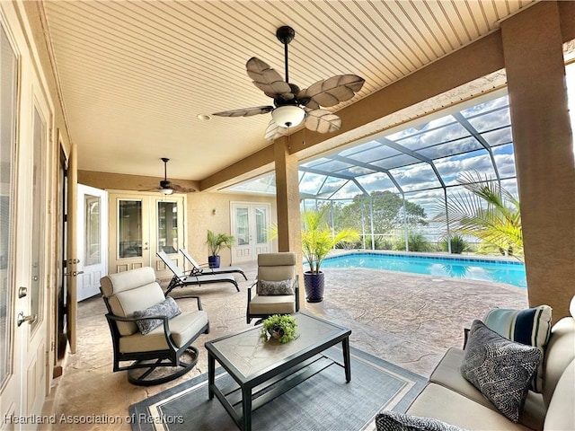 view of patio / terrace featuring glass enclosure, an outdoor hangout area, and french doors