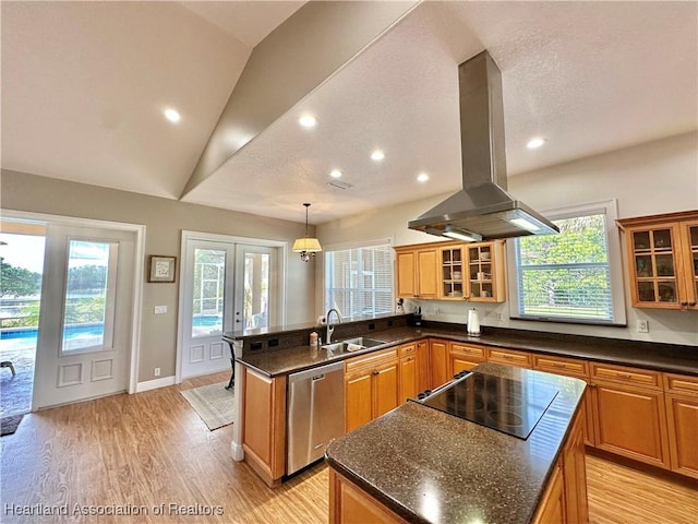 kitchen with a center island, hanging light fixtures, stainless steel dishwasher, island exhaust hood, and lofted ceiling