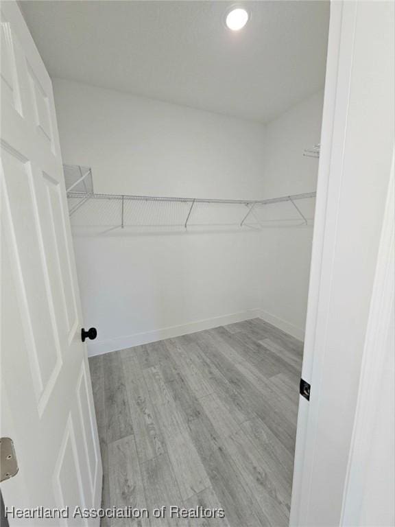 425 Floral Dr, Sebring, FL 33876 - spacious closet with light wood-type flooring