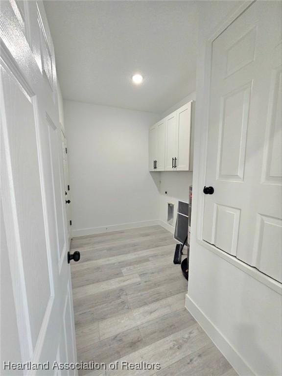 425 Floral Dr, Sebring, FL 33876 - laundry area featuring cabinet space, light wood finished floors, baseboards, an office area, and recessed lighting
