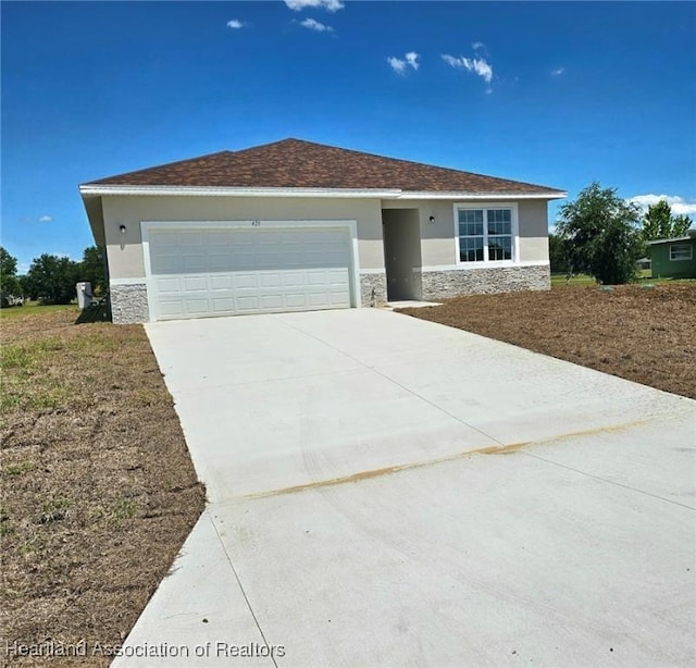 425 Floral Dr, Sebring, FL 33876 - single story home with stone siding, concrete driveway, stucco siding, and a garage