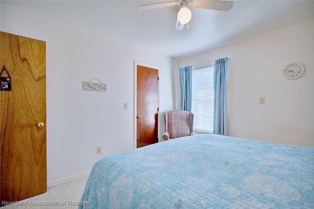 bedroom with ceiling fan and carpet