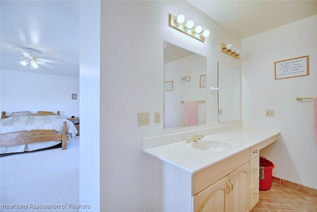 bathroom with ceiling fan and vanity