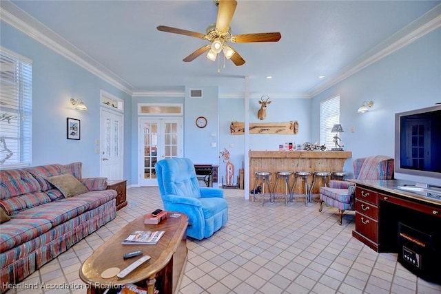 living room featuring ceiling fan, light tile patterned floors, crown molding, and french doors