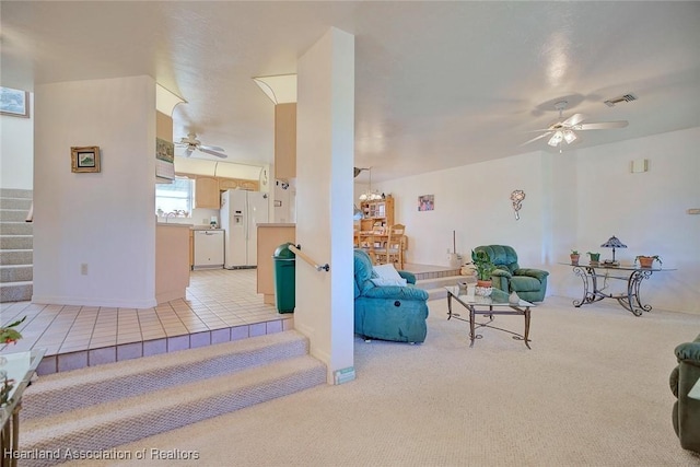 carpeted living room featuring ceiling fan