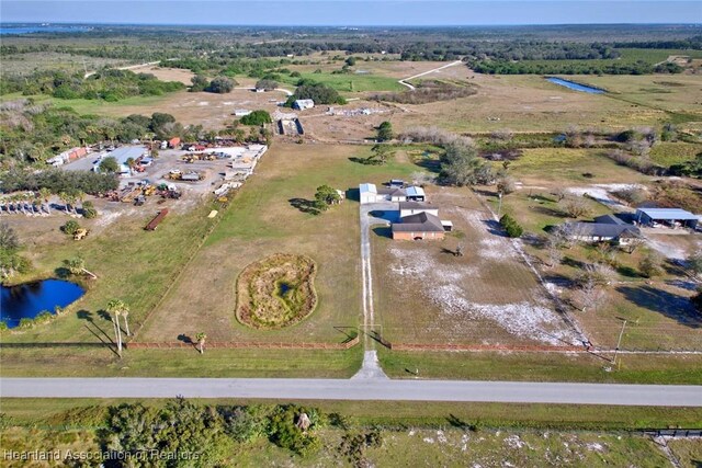 aerial view featuring a rural view and a water view