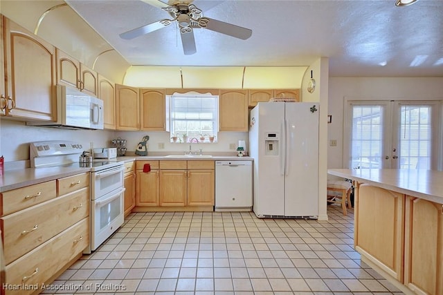 kitchen with ceiling fan, french doors, sink, white appliances, and light brown cabinetry