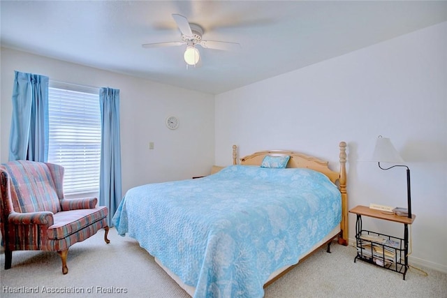 bedroom with ceiling fan and light colored carpet