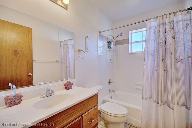 full bathroom featuring vanity, toilet, and shower / tub combo with curtain