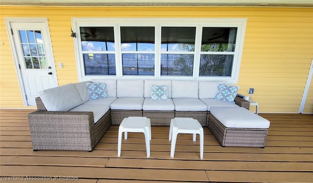 wooden terrace featuring outdoor lounge area