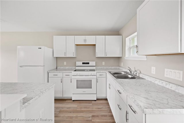 kitchen featuring white cabinetry, white appliances, sink, and light hardwood / wood-style flooring