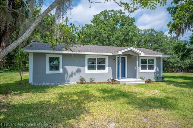 ranch-style home with a front lawn