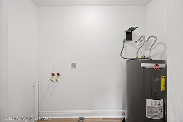 utility room featuring electric water heater