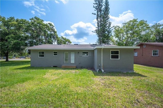 back of house with a yard