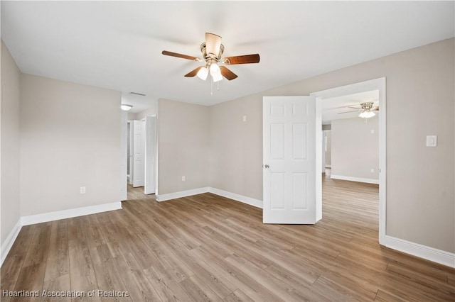 unfurnished room featuring light hardwood / wood-style floors and ceiling fan