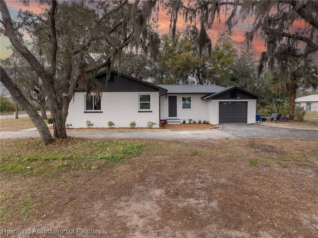 ranch-style home featuring a garage