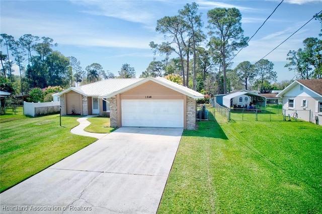 single story home featuring a garage, a front yard, concrete driveway, and fence