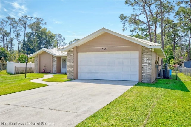 view of front of home featuring brick siding, concrete driveway, fence, a garage, and a front lawn