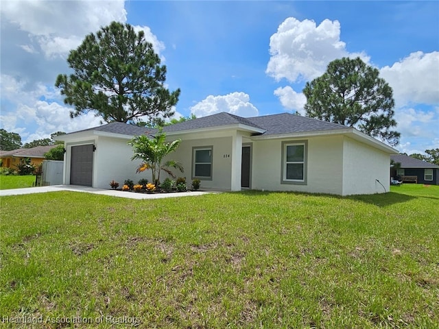 ranch-style house with a front lawn and a garage