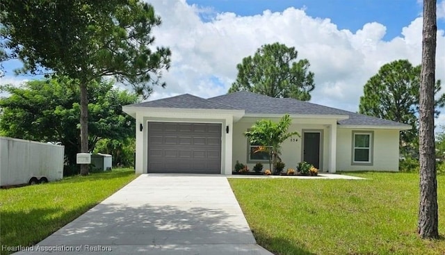 view of front of house featuring a garage and a front yard