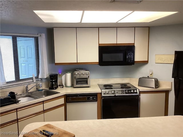 kitchen with sink and black appliances