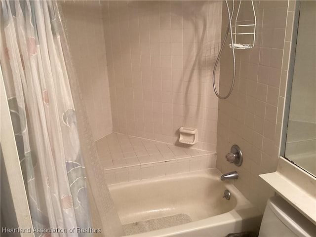 bathroom with shower / bath combination with curtain