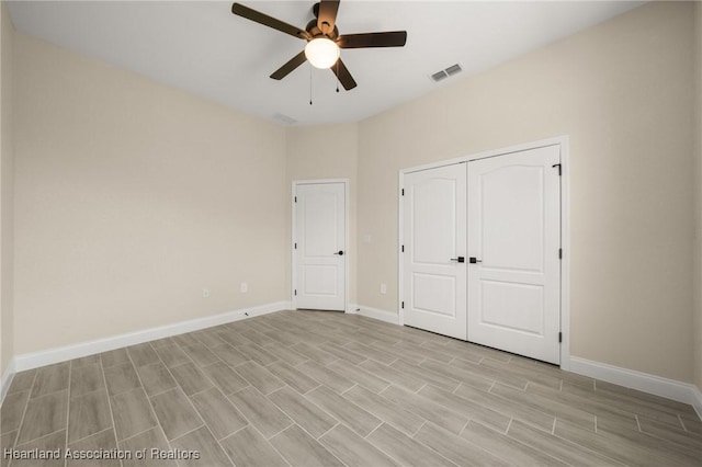 4825 Whiting Dr, Sebring, FL 33870 - unfurnished bedroom featuring a closet, baseboards, ceiling fan, visible vents, and light wood-style floors