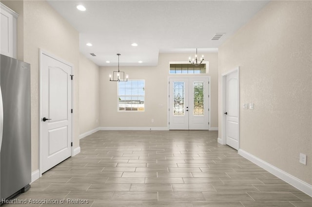 4825 Whiting Dr, Sebring, FL 33870 - foyer with wood finish floors, visible vents, recessed lighting, a chandelier, and baseboards