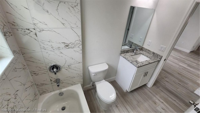 full bathroom with hardwood / wood-style flooring, vanity, toilet, and tiled shower / bath