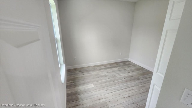 spare room featuring light hardwood / wood-style flooring