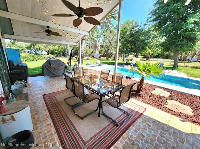 view of patio with ceiling fan and area for grilling