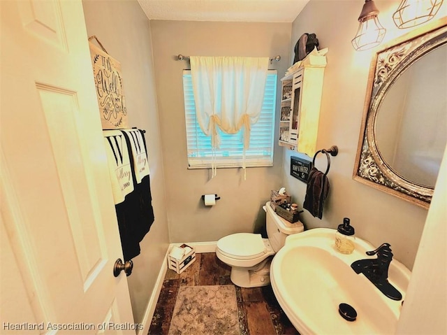 bathroom with sink and toilet