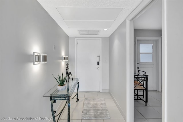 hall with light tile patterned flooring