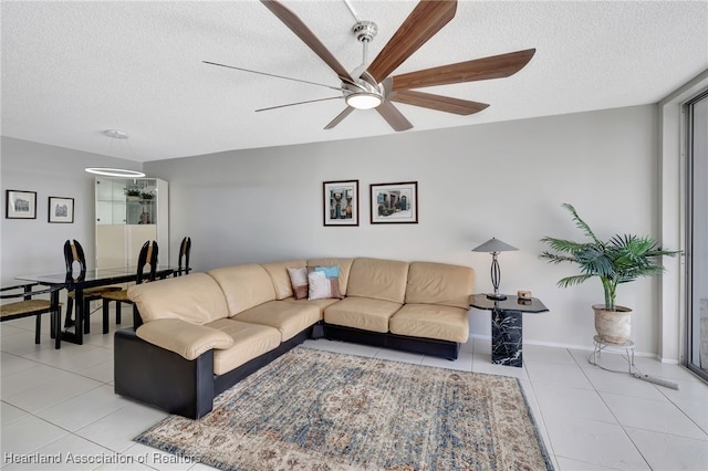 living room with light tile patterned floors and a textured ceiling