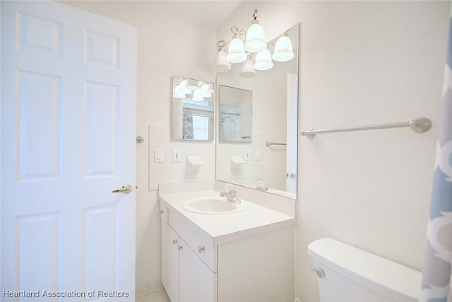 bathroom with vanity and toilet