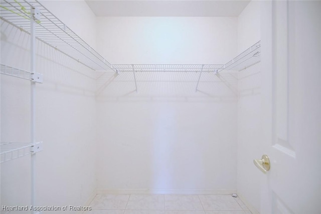 walk in closet featuring light tile patterned floors