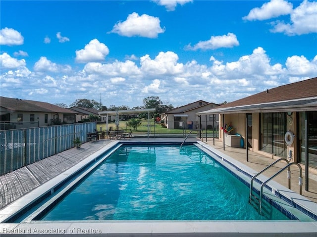 view of swimming pool featuring a patio