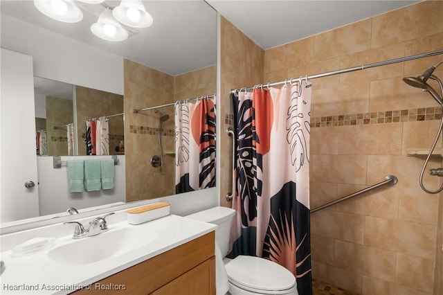 bathroom featuring vanity, toilet, and a shower with shower curtain