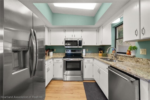 kitchen with stainless steel appliances and white cabinets