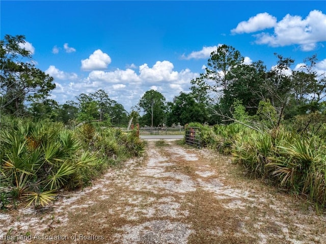 9131 Bridle Path, Sebring, FL 33875 - view of street featuring a gate